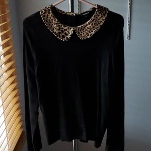 Black long sleeves top with animal print collar, a